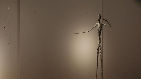 贾科梅蒂雕塑《指点的人》